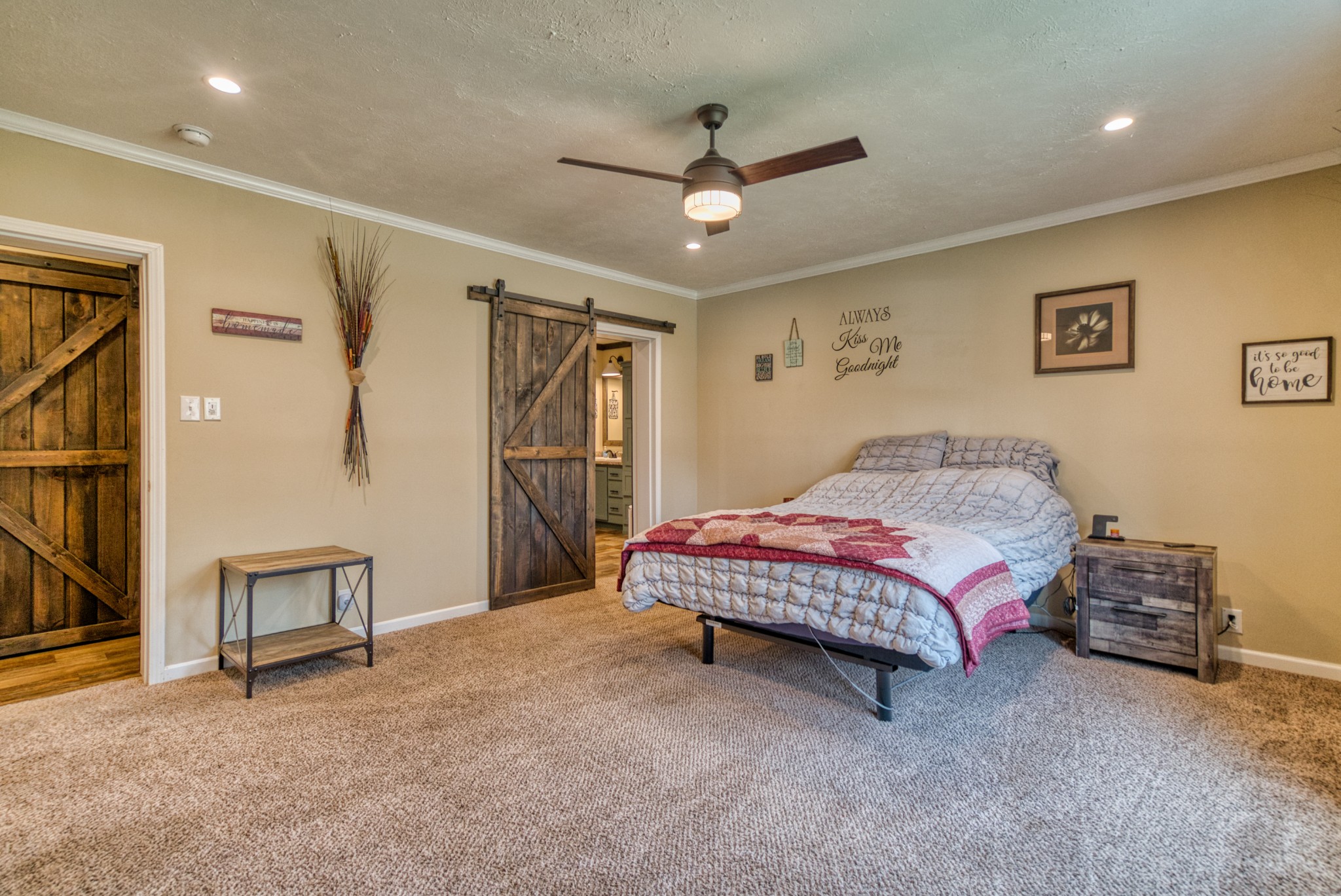 721 Spa Road Lewisburg, KY 42256 - Photo 37 of 56 a bedroom with a bed and a chandelier