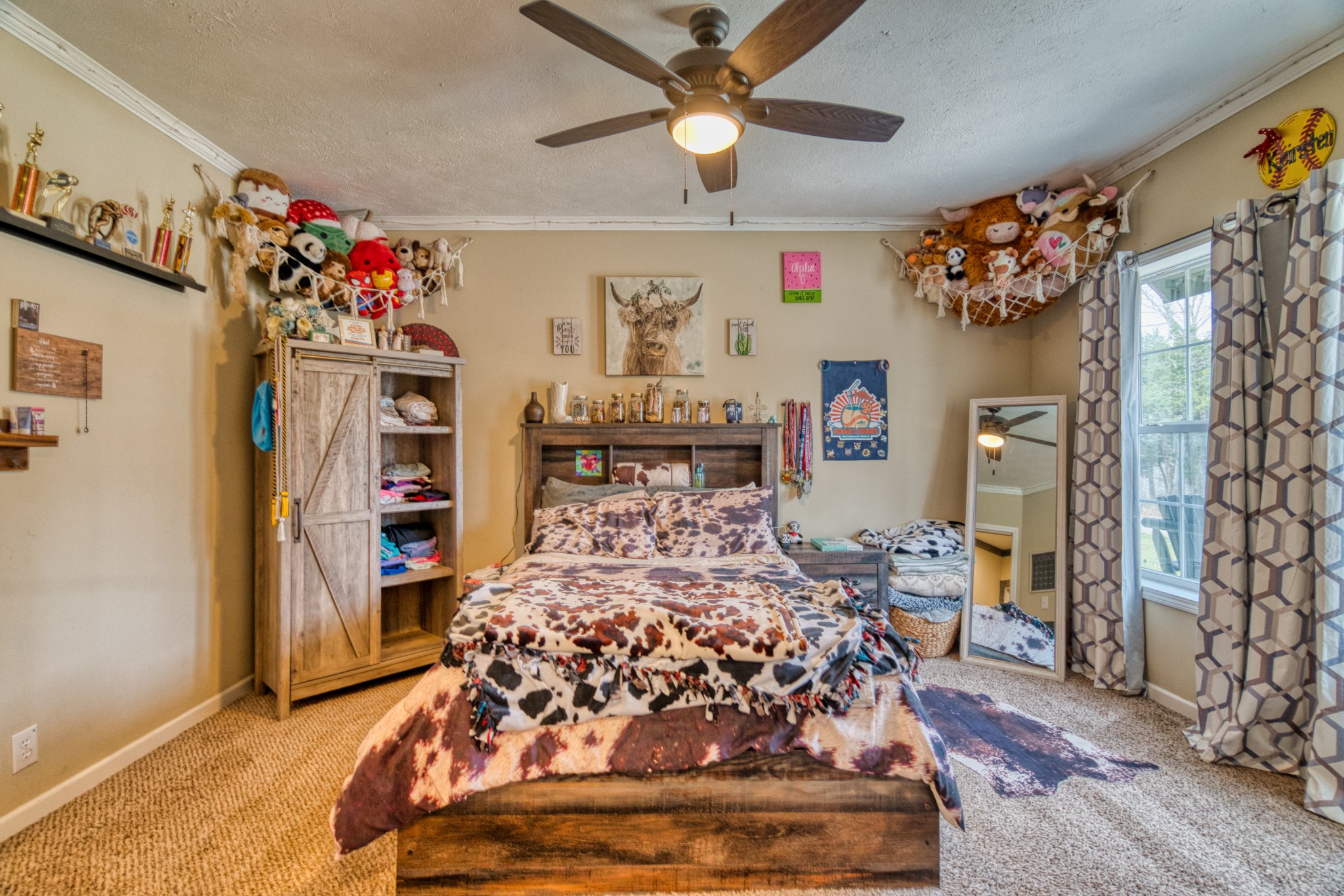 721 Spa Road Lewisburg, KY 42256 - Photo 55 of 56 a bed sitting in a bedroom next to a window and a chandelier