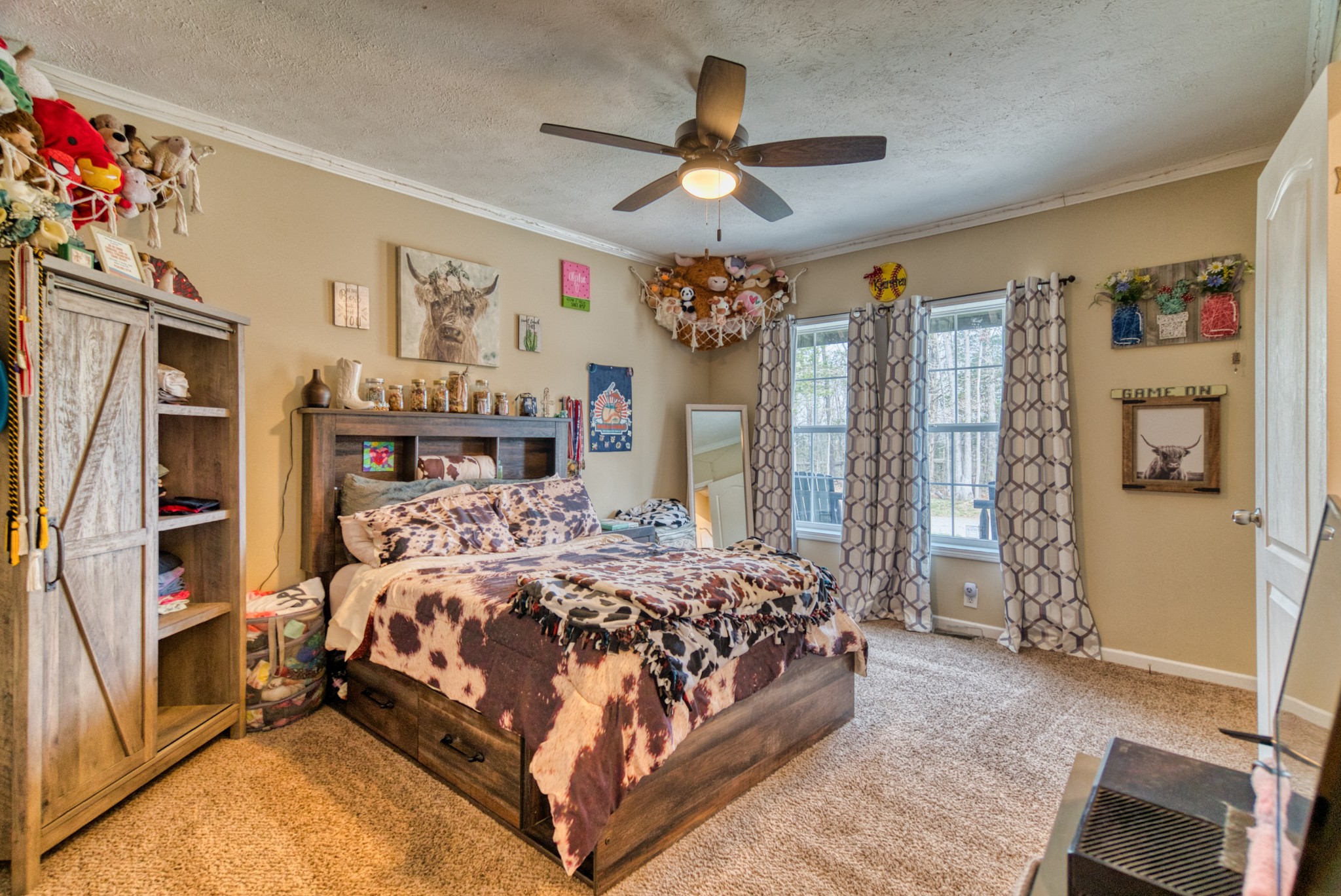 721 Spa Road Lewisburg, KY 42256 - Photo 56 of 56 a bedroom with a large bed and a chandelier