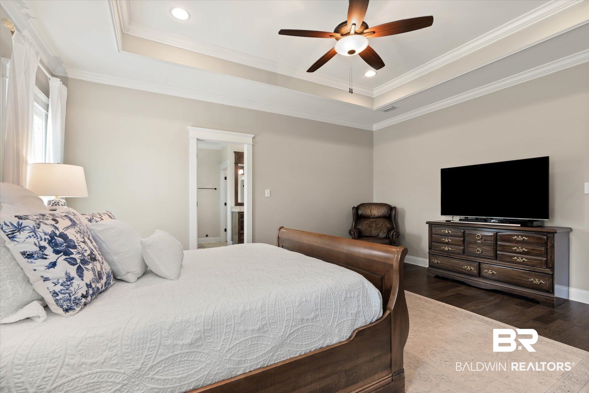 24821 Austin Road Daphne, AL 36526 - Photo 10 of 24 Bedroom featuring a tray ceiling, dark wood-type flooring, recessed lighting, ornamental molding, and ceiling fan