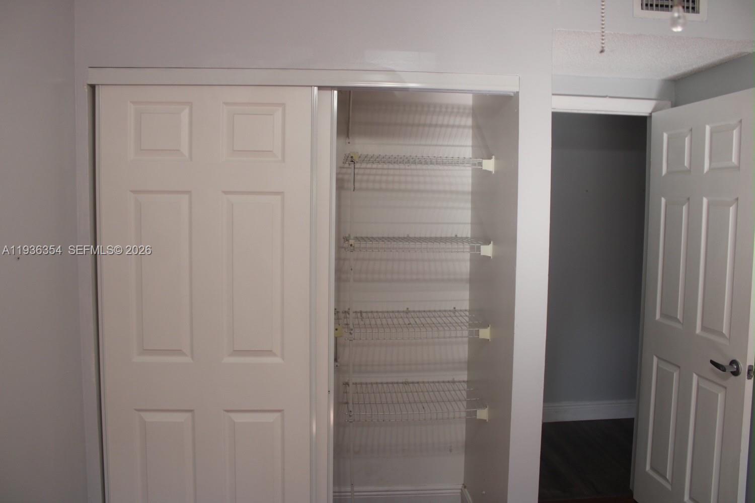 8925 Springtree Lakes Drive Sunrise, FL 33351 - Photo 14 of 19 a view of walk in closet