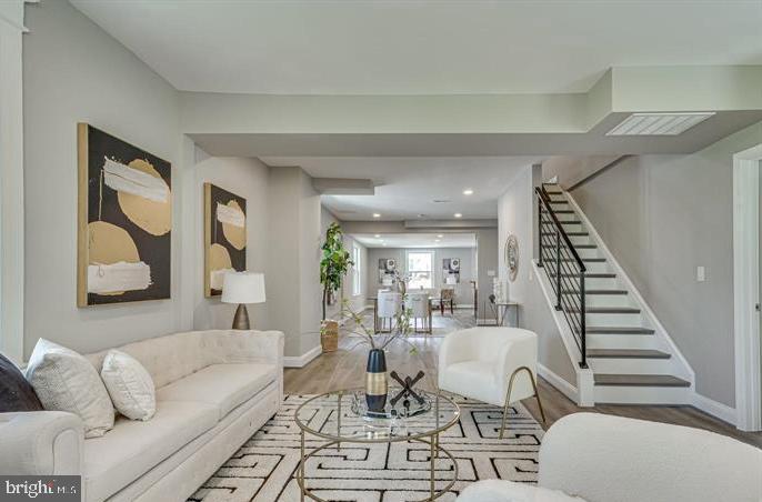 4105 30th Street Mount Rainier, MD 20712 - Photo 12 of 98 a living room with furniture and a painting