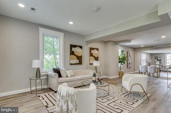 4105 30th Street Mount Rainier, MD 20712 - Photo 14 of 98 a living room with furniture and a window