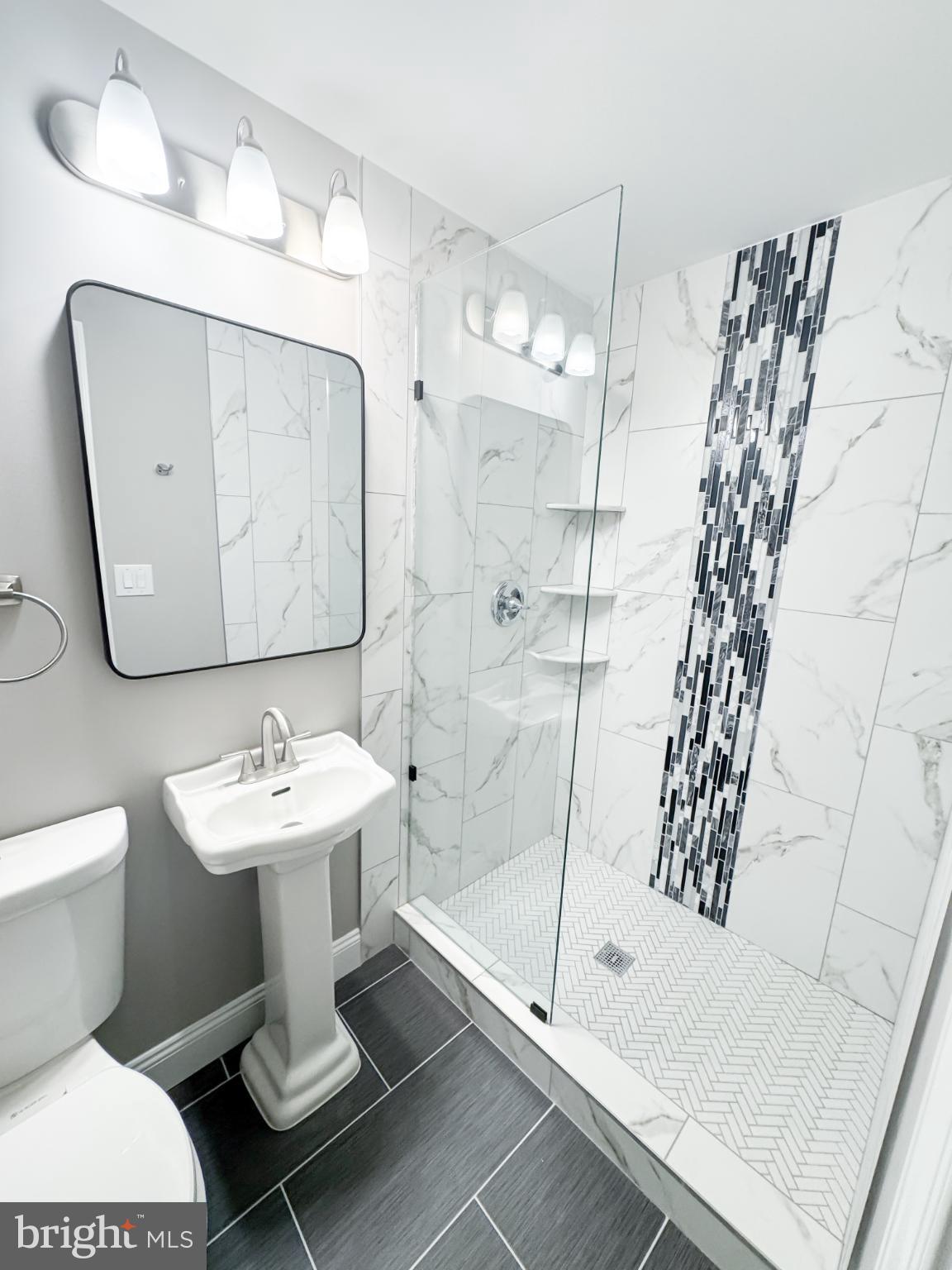 4105 30th Street Mount Rainier, MD 20712 - Photo 71 of 98 a bathroom with a sink toilet and shower