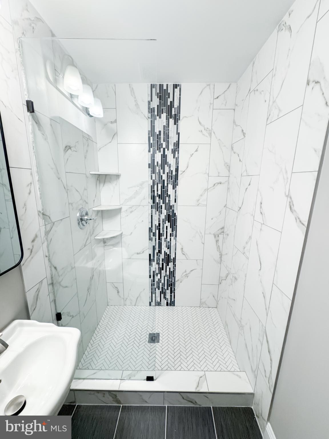 4105 30th Street Mount Rainier, MD 20712 - Photo 72 of 98 Sleek modern shower with elegant tile design.