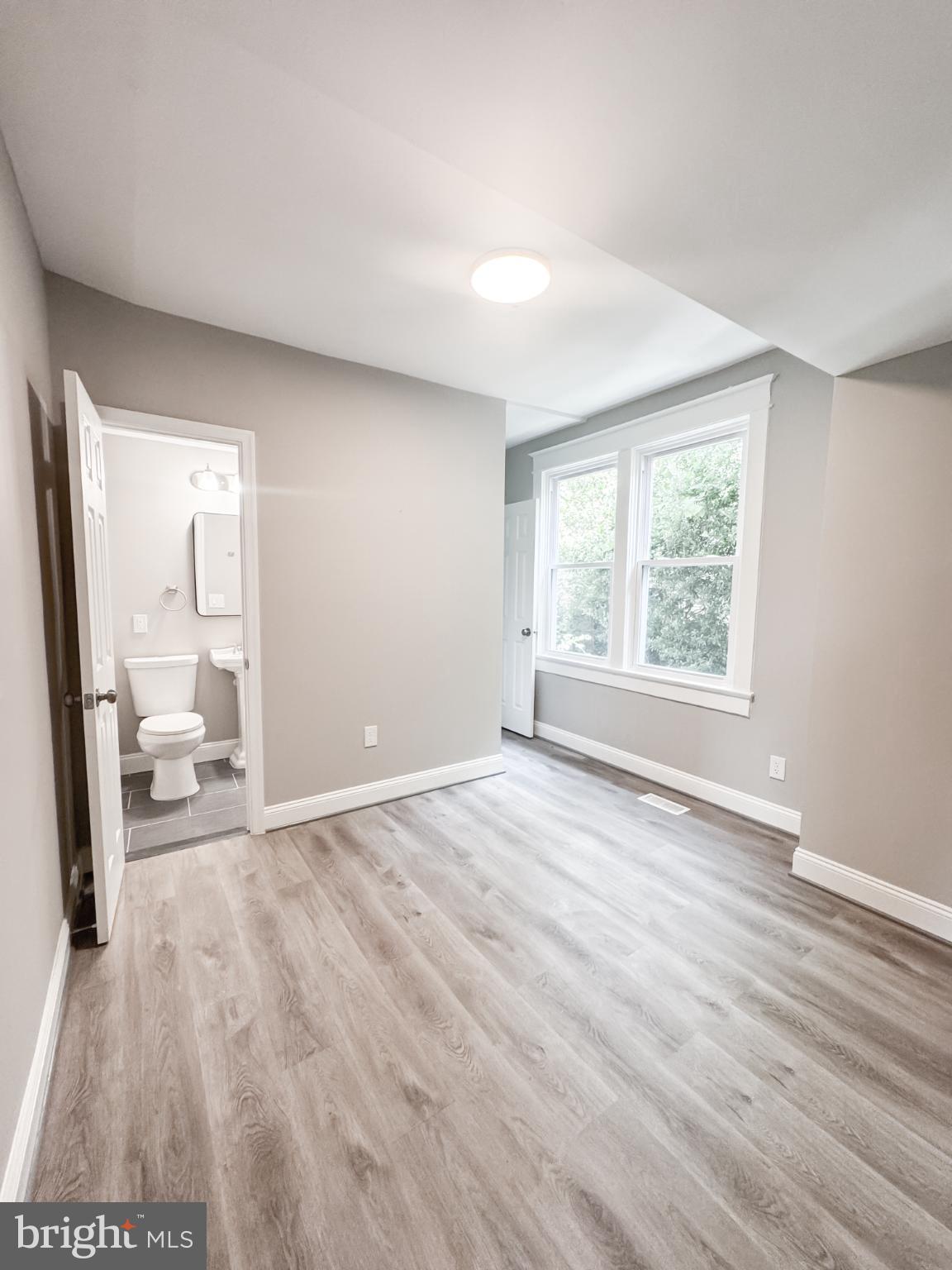 4105 30th Street Mount Rainier, MD 20712 - Photo 74 of 98 wooden floor in an empty room with a window