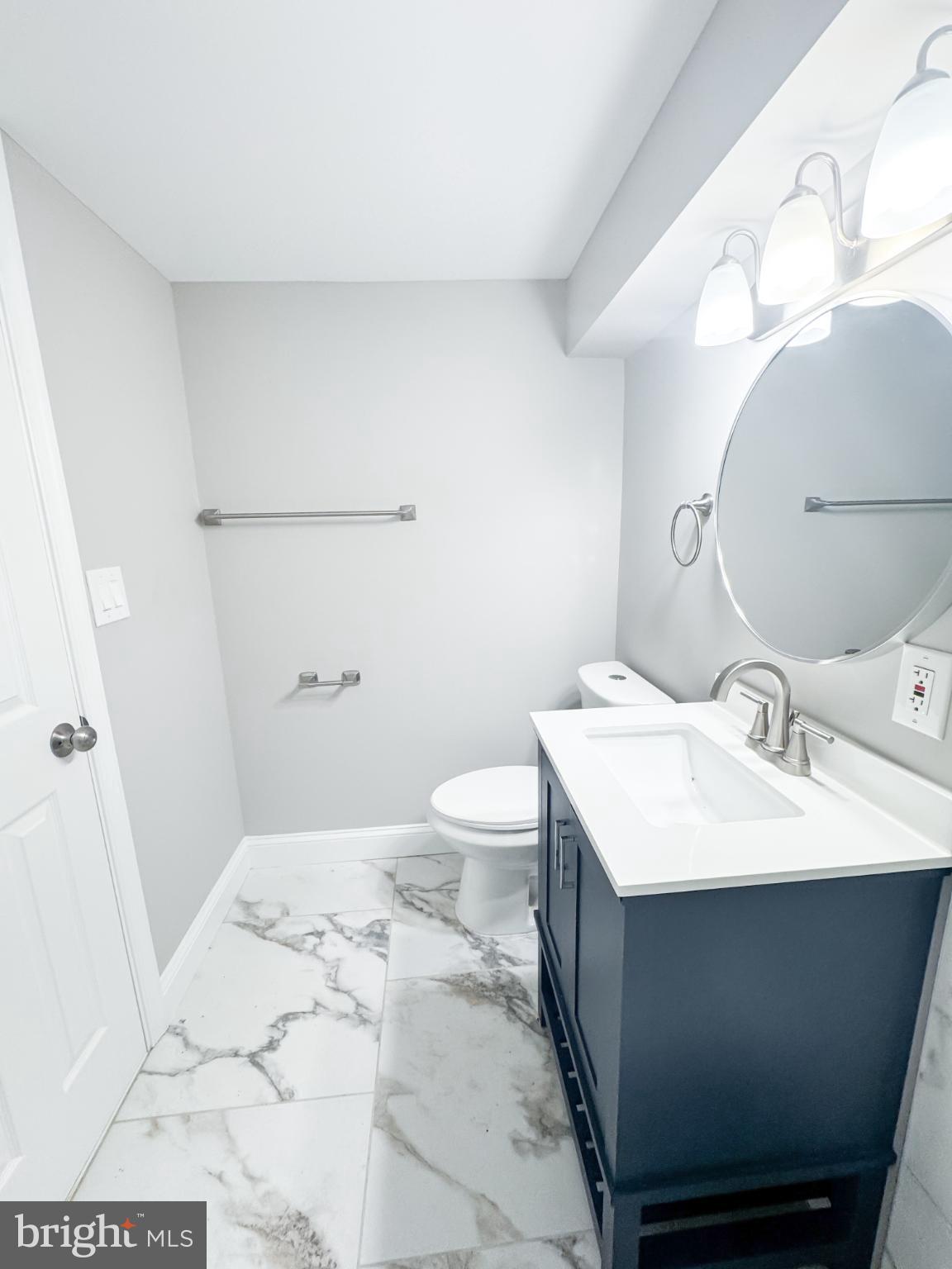 4105 30th Street Mount Rainier, MD 20712 - Photo 89 of 98 a bathroom with a sink toilet and mirror