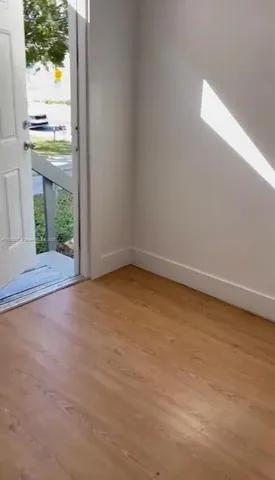 a white toilet sitting next to a bath tub