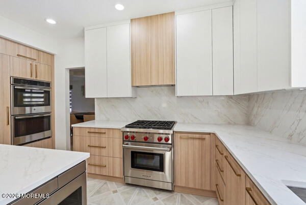 54 Georgetown Road Eatontown, NJ 07724 - Photo 4 of 24 a kitchen with a stove and a refrigerator