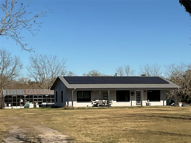 a front view of a building with a ocean view