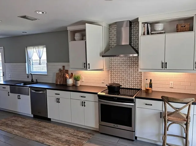 a spacious bedroom with a bed and a couch