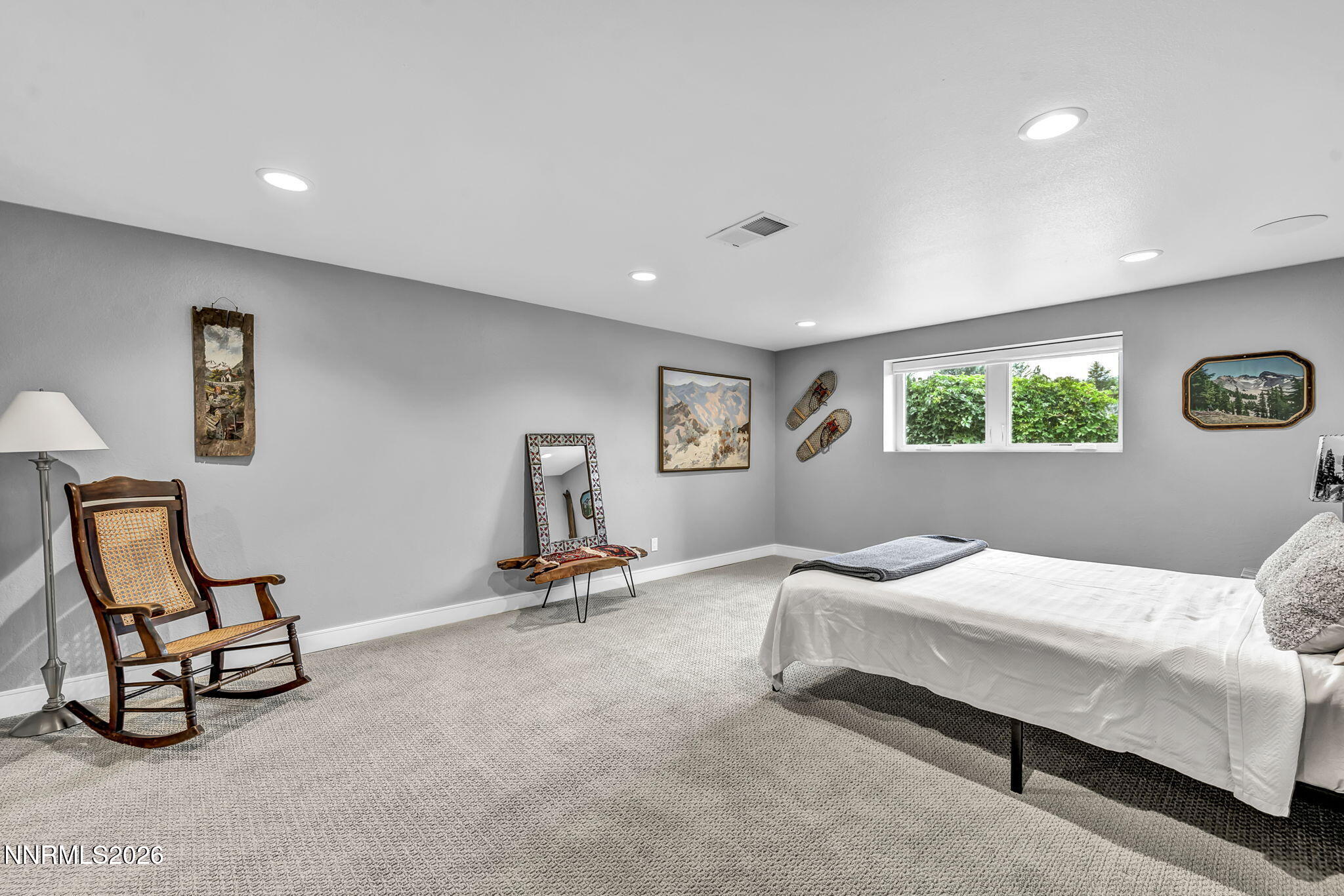 4865 Lakeridge Terrace West Reno, NV 89509 - Photo 36 of 51 a bedroom with a bed a table and chair