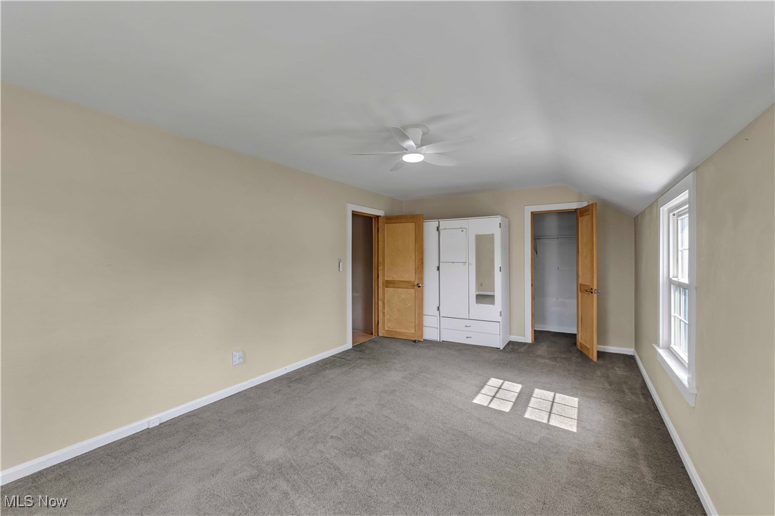 15388 Ridge Road North Royalton, OH 44133 - Photo 17 of 45 Unfurnished bedroom with carpet, vaulted ceiling, and ceiling fan