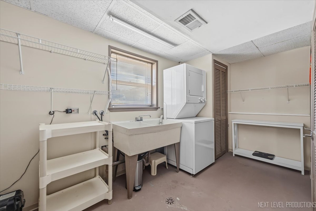 754 North Michigan Street Elmhurst, IL 60126 - Photo 24 of 32 a bathroom with a sink and a washing machine