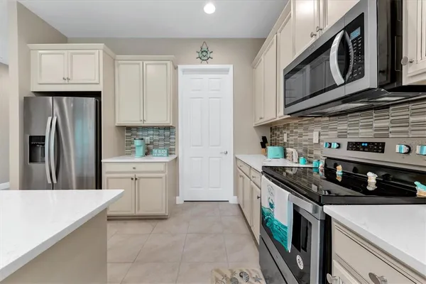 a spacious bathroom with a mirror a shower and vanity