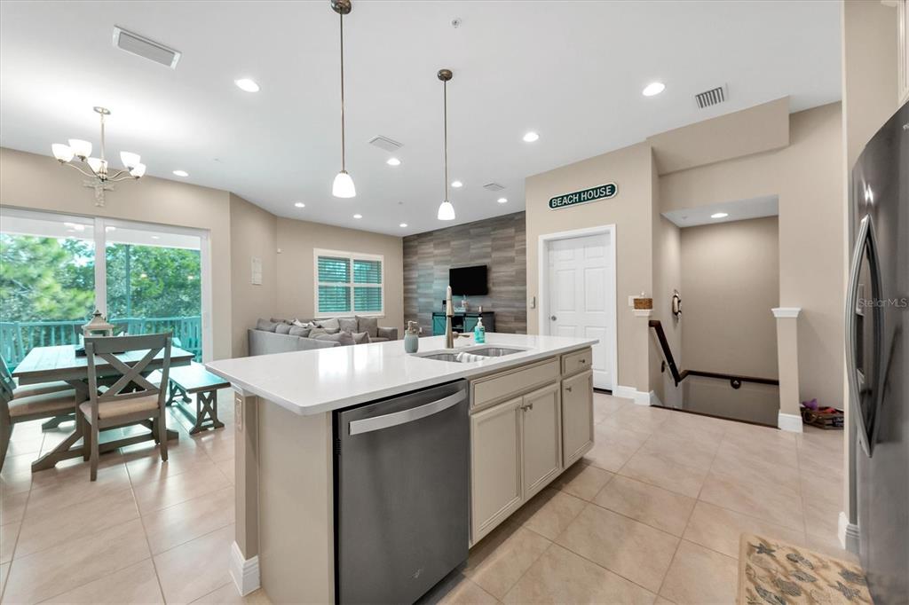 10425 Pilothouse Circle, Unit 130 Placida, FL 33946 - Photo 32 of 76 a large kitchen with kitchen island a large island in it