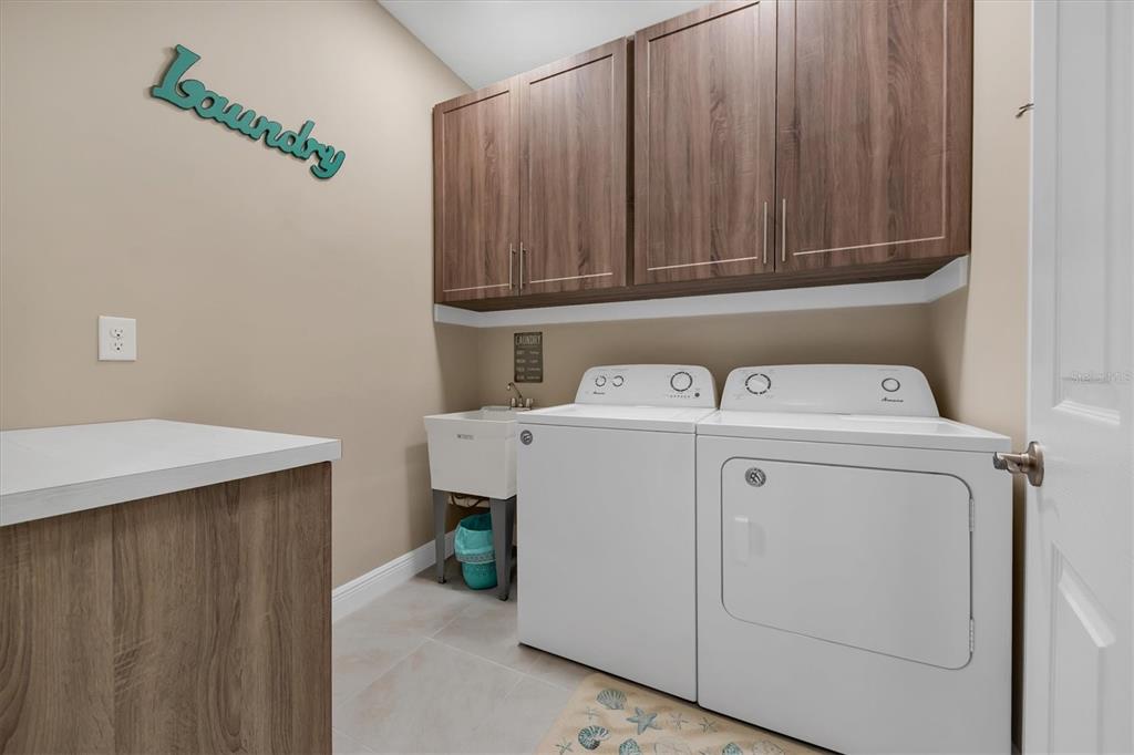 10425 Pilothouse Circle, Unit 130 Placida, FL 33946 - Photo 60 of 76 a utility room with dryer and washer