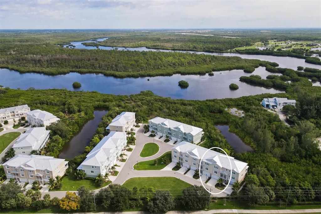 10425 Pilothouse Circle, Unit 130 Placida, FL 33946 - Photo 7 of 76 an aerial view of a house with a garden