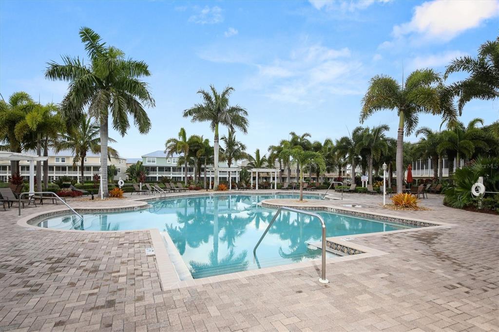 10425 Pilothouse Circle, Unit 130 Placida, FL 33946 - Photo 73 of 76 a view of a swimming pool and lounge chair