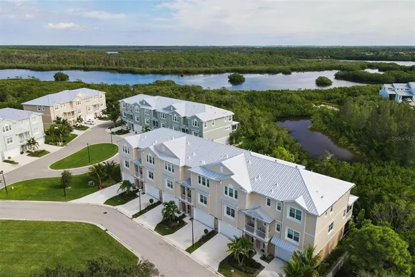 a front view of house and yard with green space