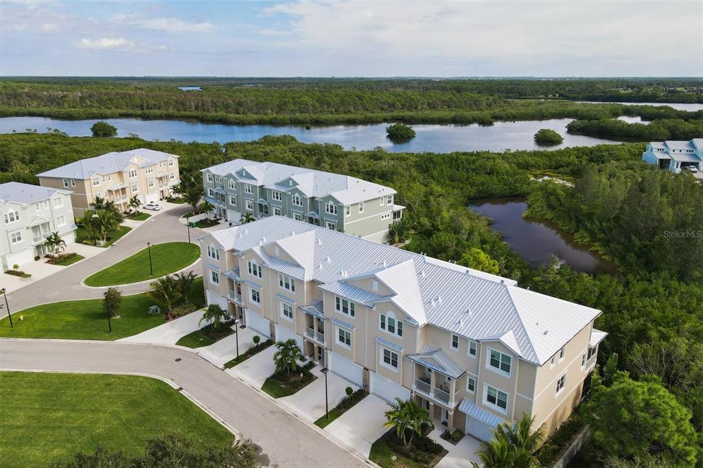 10425 Pilothouse Circle, Unit 130 Placida, FL 33946 - Photo 9 of 76 an aerial view of a house with a garden and lake view