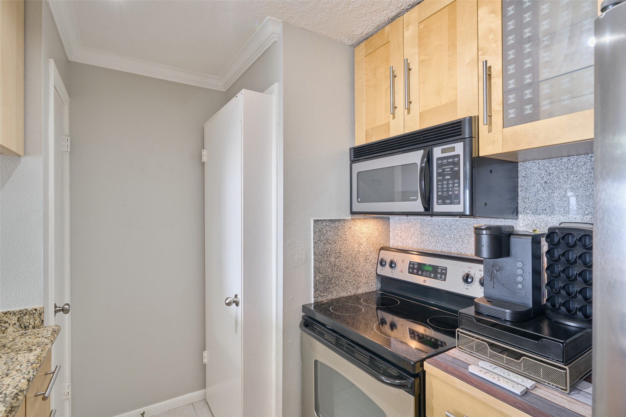 801 River Road, Unit 105D Montgomery, TX 77356 - Photo 15 of 32 Condo is all electric. Note electric range & microwave