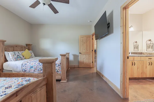 a bed room with a bed and a television