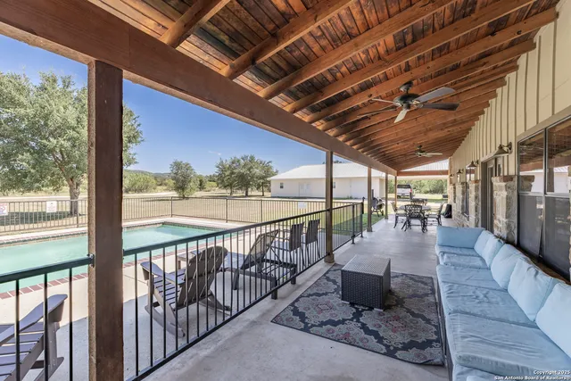 a view of a porch with wooden floor