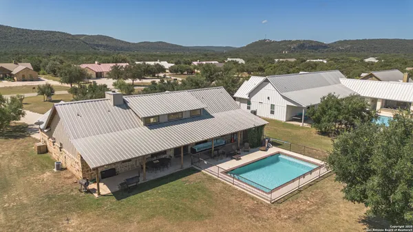 an aerial view of a house with a garden