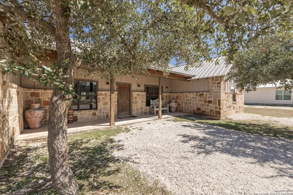 a tree in front of a house