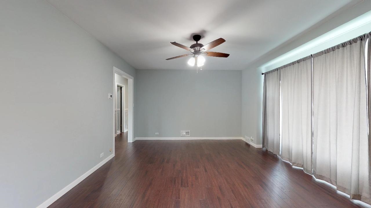7624 Forest Avenue Munster, IN 46321 - Photo 12 of 37 a view of empty room with wooden floor and fan
