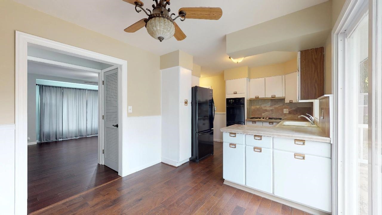 7624 Forest Avenue Munster, IN 46321 - Photo 15 of 37 a kitchen with stainless steel appliances granite countertop a refrigerator and a stove top oven