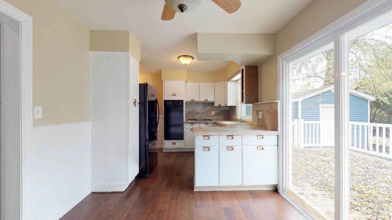7624 Forest Avenue Munster, IN 46321 - Photo 17 of 37 a kitchen with granite countertop a refrigerator and a sink