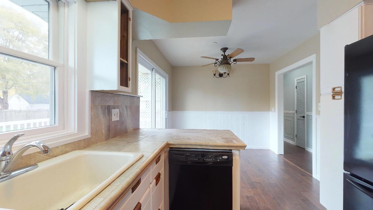 7624 Forest Avenue Munster, IN 46321 - Photo 20 of 37 a kitchen with a sink a stove and a refrigerator