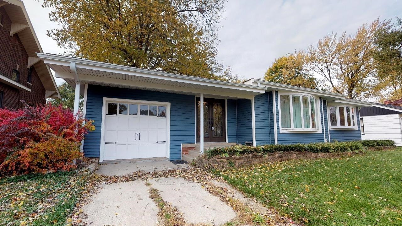 7624 Forest Avenue Munster, IN 46321 - Photo 2 of 37 a front view of a house with a garden