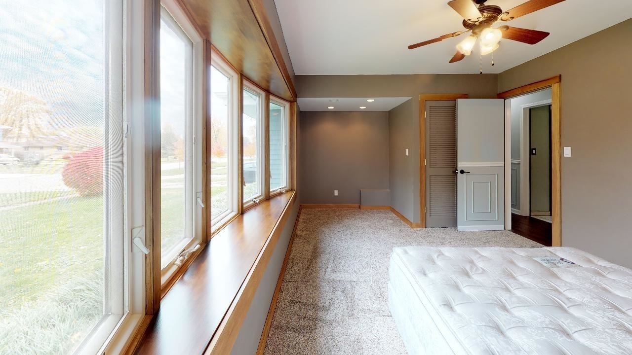 7624 Forest Avenue Munster, IN 46321 - Photo 23 of 37 a view of a hallway with a chandelier