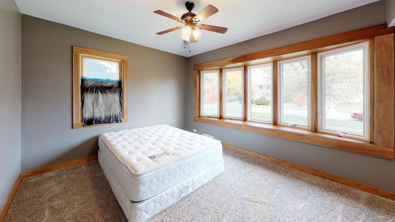 7624 Forest Avenue Munster, IN 46321 - Photo 24 of 37 a living room with a bed and a window