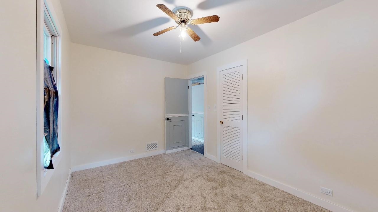7624 Forest Avenue Munster, IN 46321 - Photo 25 of 37 a view of a hallway with a chandelier fan