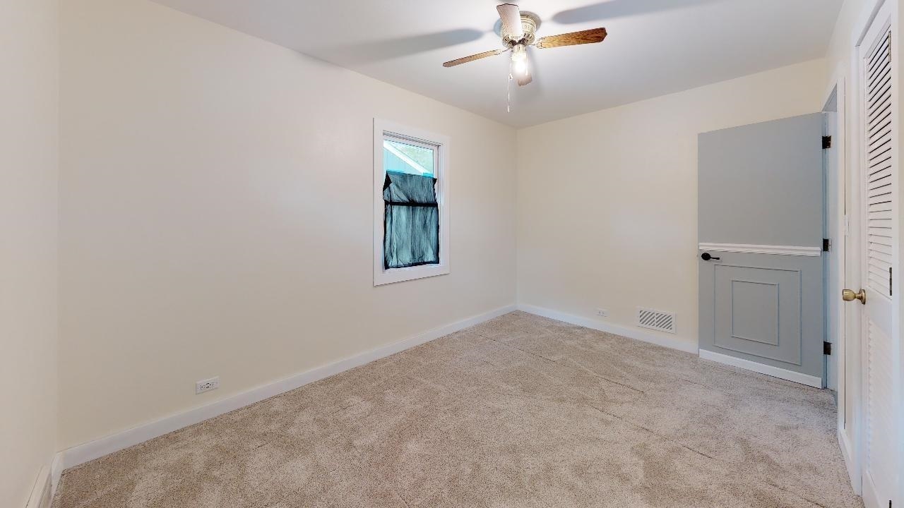 7624 Forest Avenue Munster, IN 46321 - Photo 26 of 37 an empty room with windows and fan