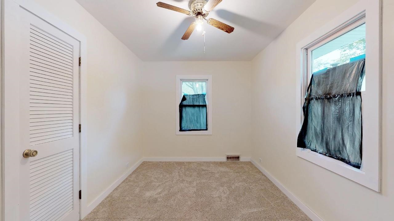 7624 Forest Avenue Munster, IN 46321 - Photo 28 of 37 an empty room with windows and closet