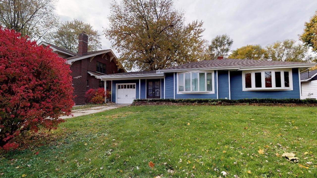 7624 Forest Avenue Munster, IN 46321 - Photo 3 of 37 a view of a house with a yard and potted plants