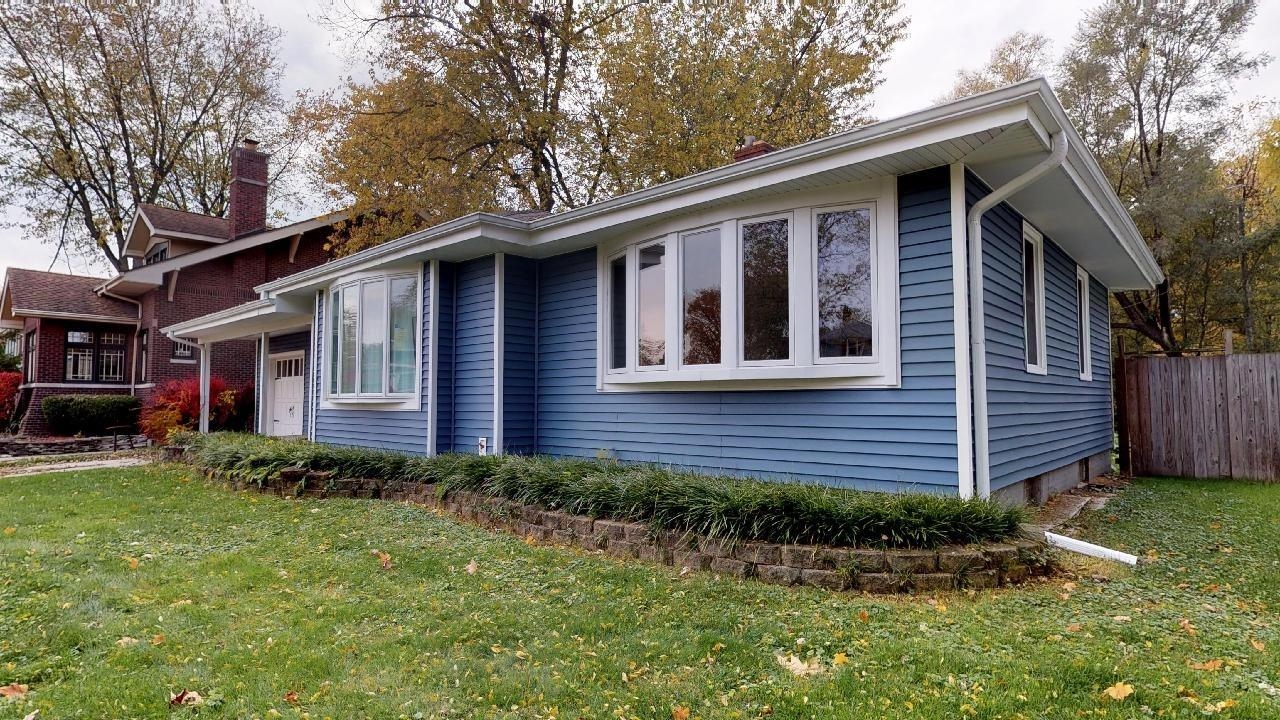 7624 Forest Avenue Munster, IN 46321 - Photo 4 of 37 a front view of a house with garden