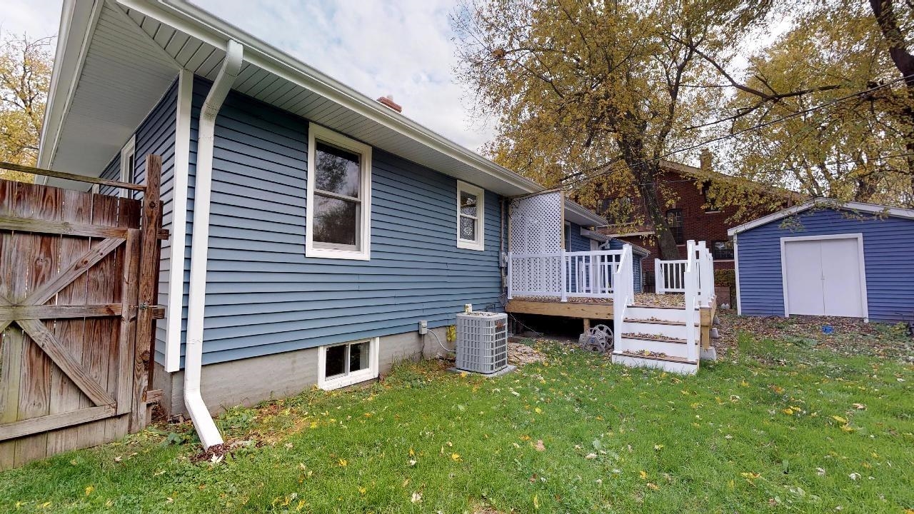 7624 Forest Avenue Munster, IN 46321 - Photo 5 of 37 a front view of a house with a garden