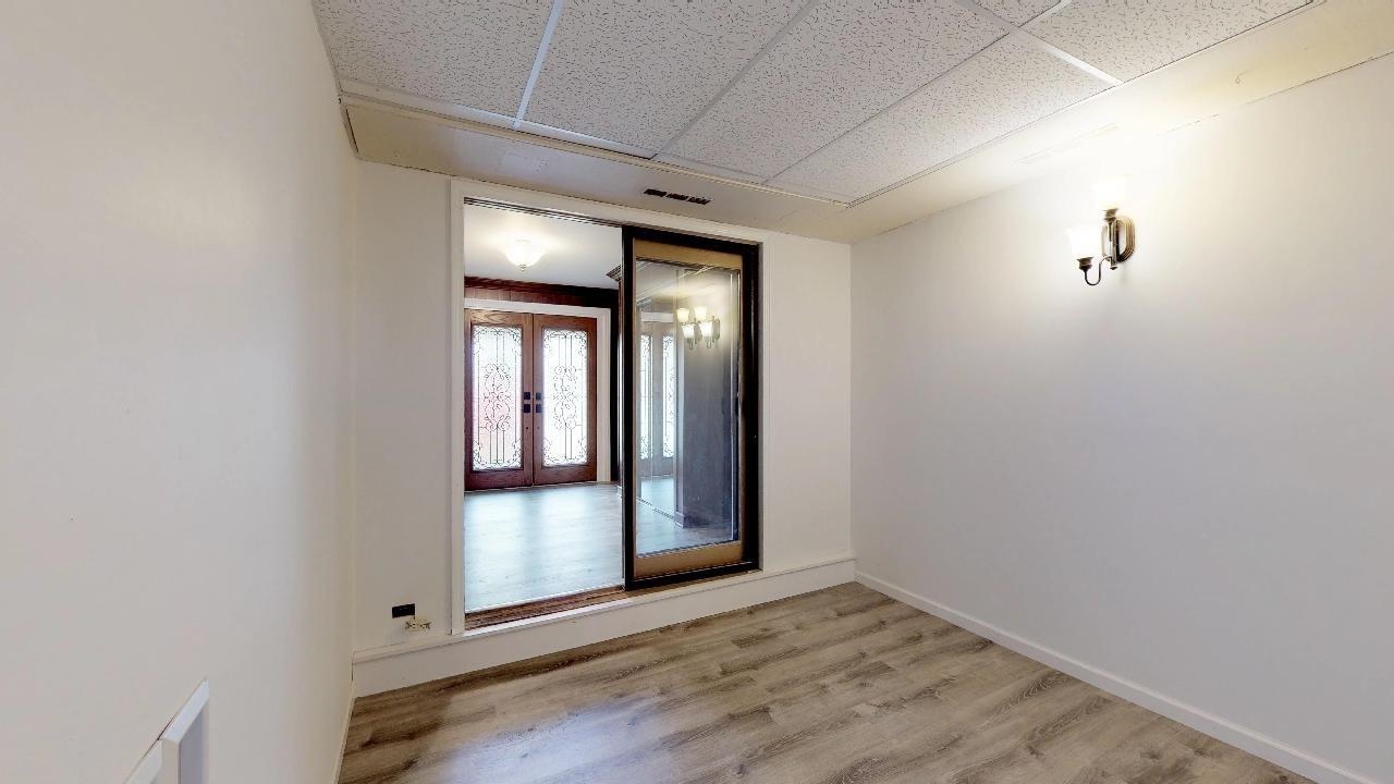 7624 Forest Avenue Munster, IN 46321 - Photo 9 of 37 a view of an empty room with wooden floor and a window