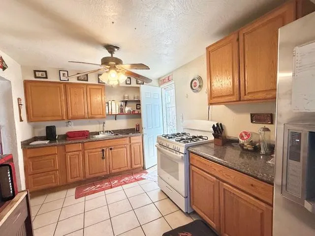 a kitchen with a sink cabinets and window