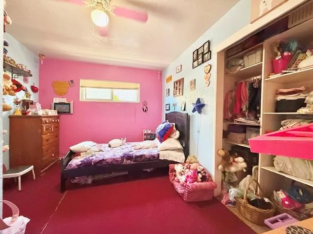 a bedroom with furniture and a chandelier