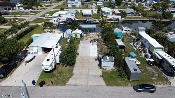 an aerial view of multiple houses with yard
