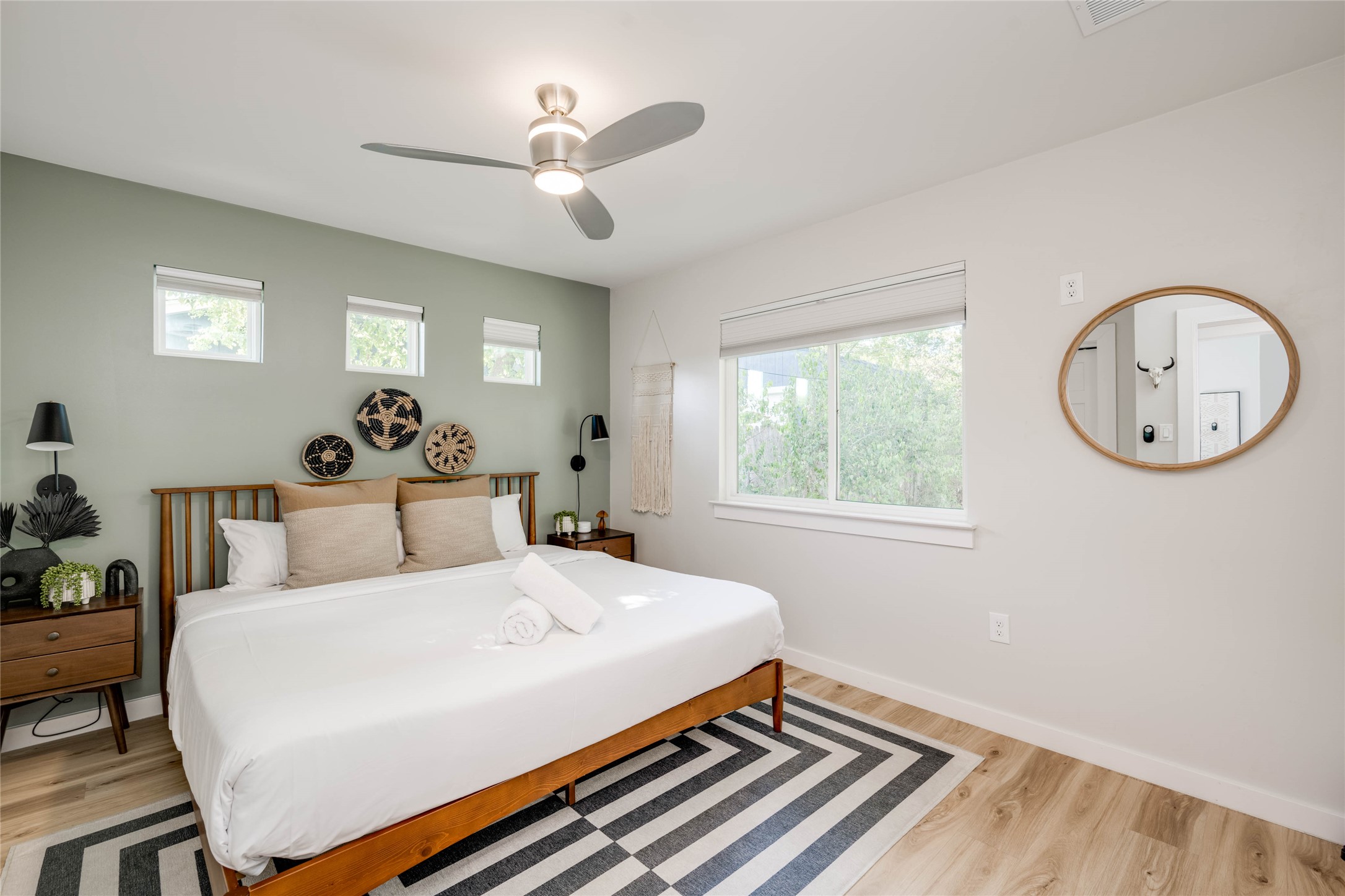 2516 Friar Tuck Lane Austin, TX 78704 - Photo 18 of 40 a bed room with a bed mirror and a window