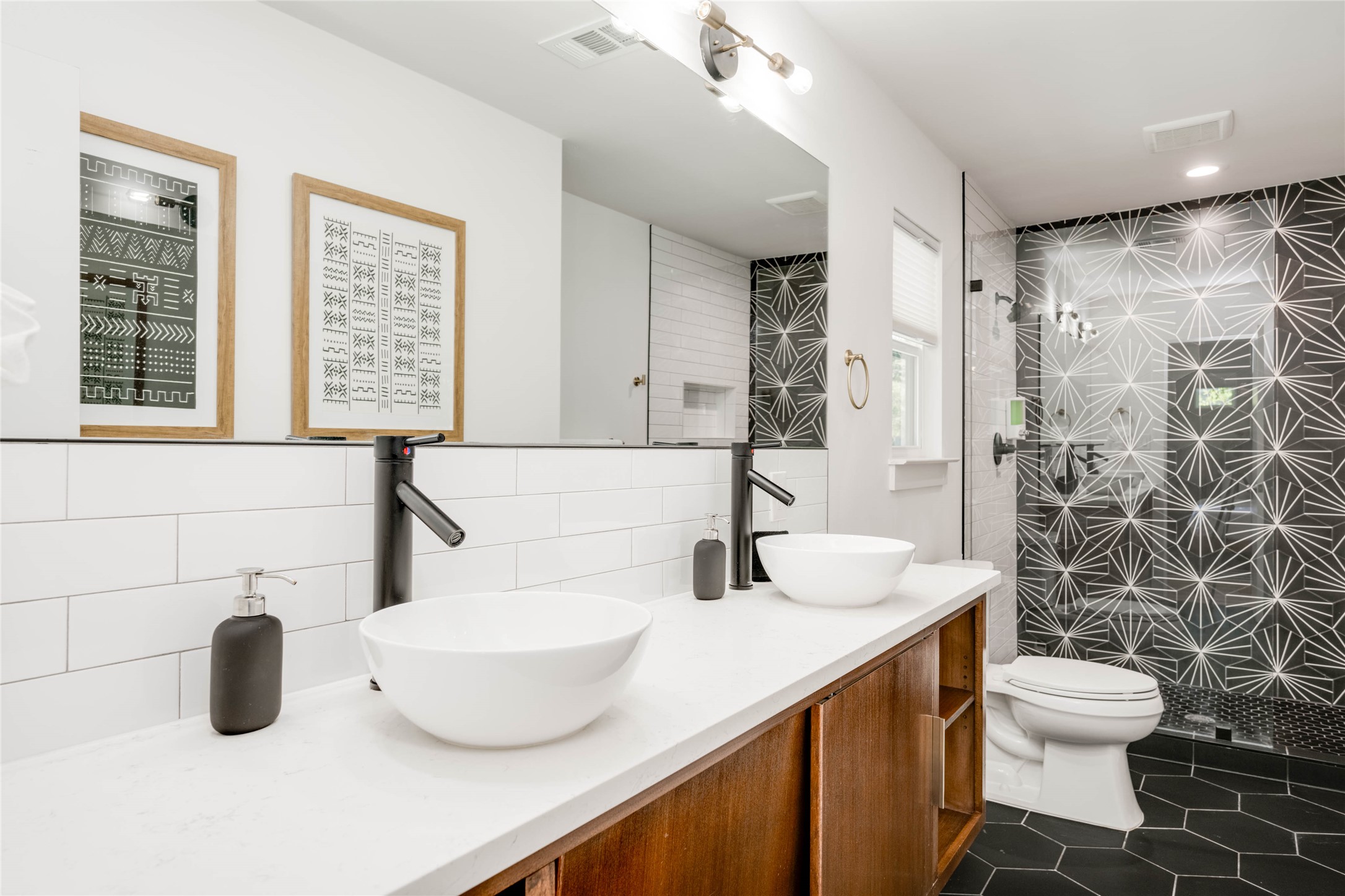 2516 Friar Tuck Lane Austin, TX 78704 - Photo 21 of 40 a bathroom with a sink and a mirror