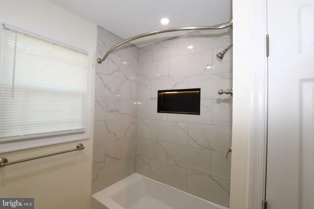 a bathroom with a shower and a toilet